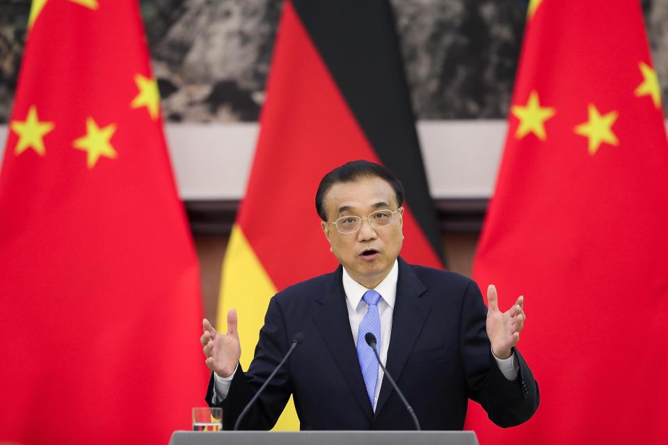  China's Premier Li Keqiang speaks during a press conference with German Chancellor Angela Merkel