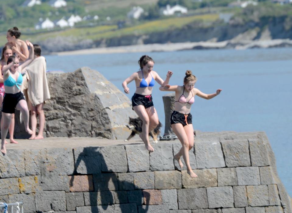  Friends take the plunge at Old Head in County Mayo, Ireland