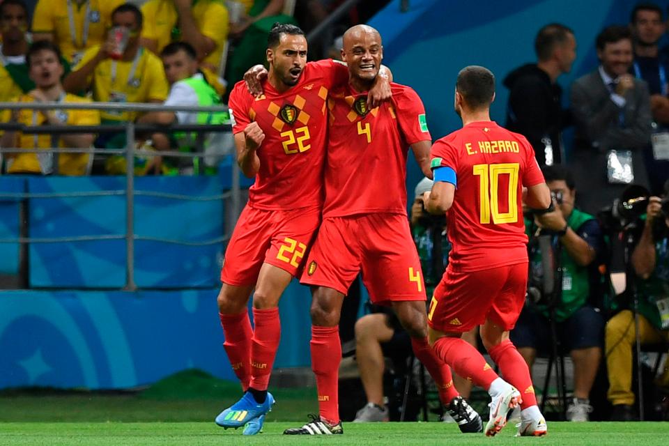  Nacer Chadli, Vincent Kompany and Eden Hazard celebrate their opening goal against Brazil.