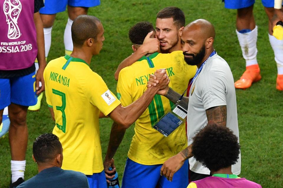  Eden Hazard whispers words of consolation into the ear of Neymar