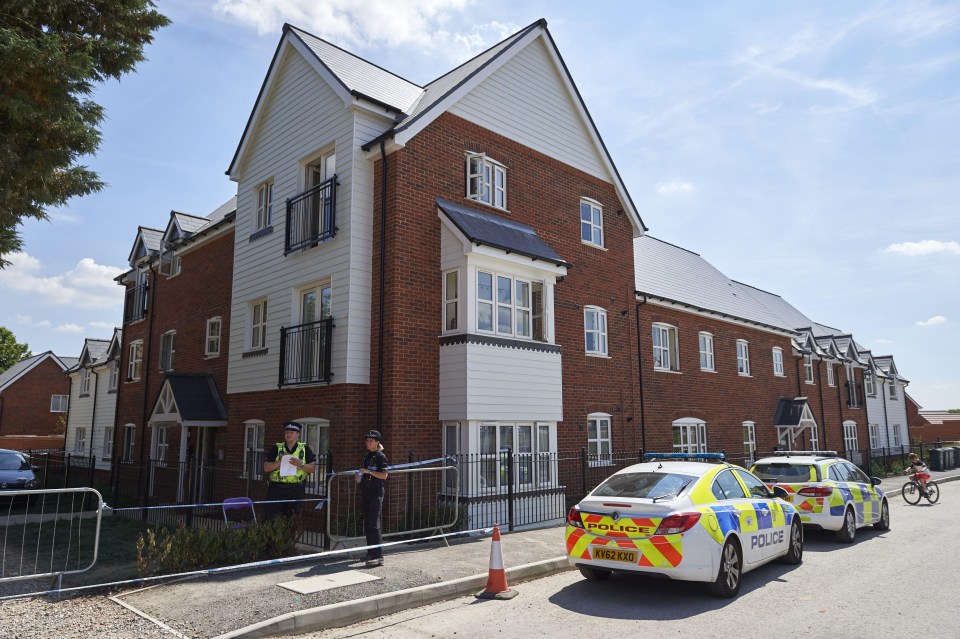 Police officers stand guard at a residential house in Amesbury, where Dawn Sturgess collapsed on June 30