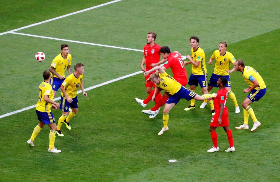 Maguire heads in England's opener during the 2-0 win over Sweden at the 2018 World Cup