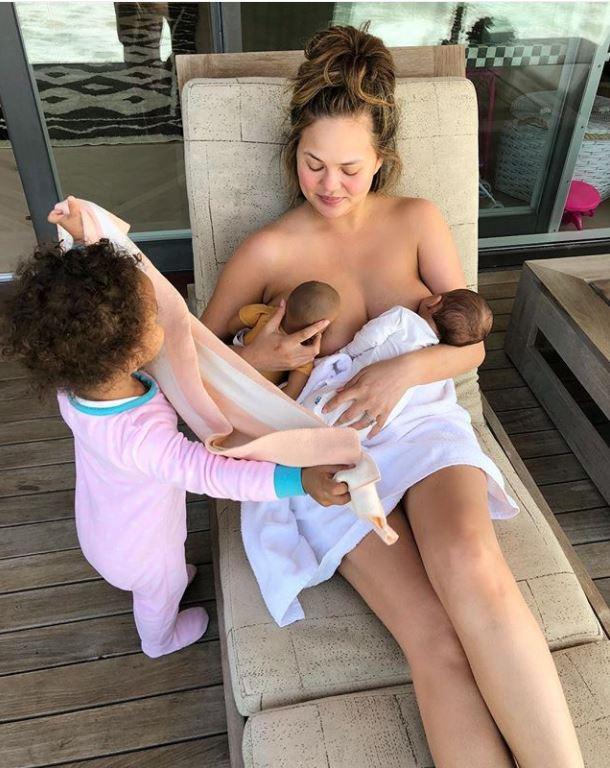  Chrissy uploaded this snap of her breast feeding her newborn Miles and her daughter Luna's doll