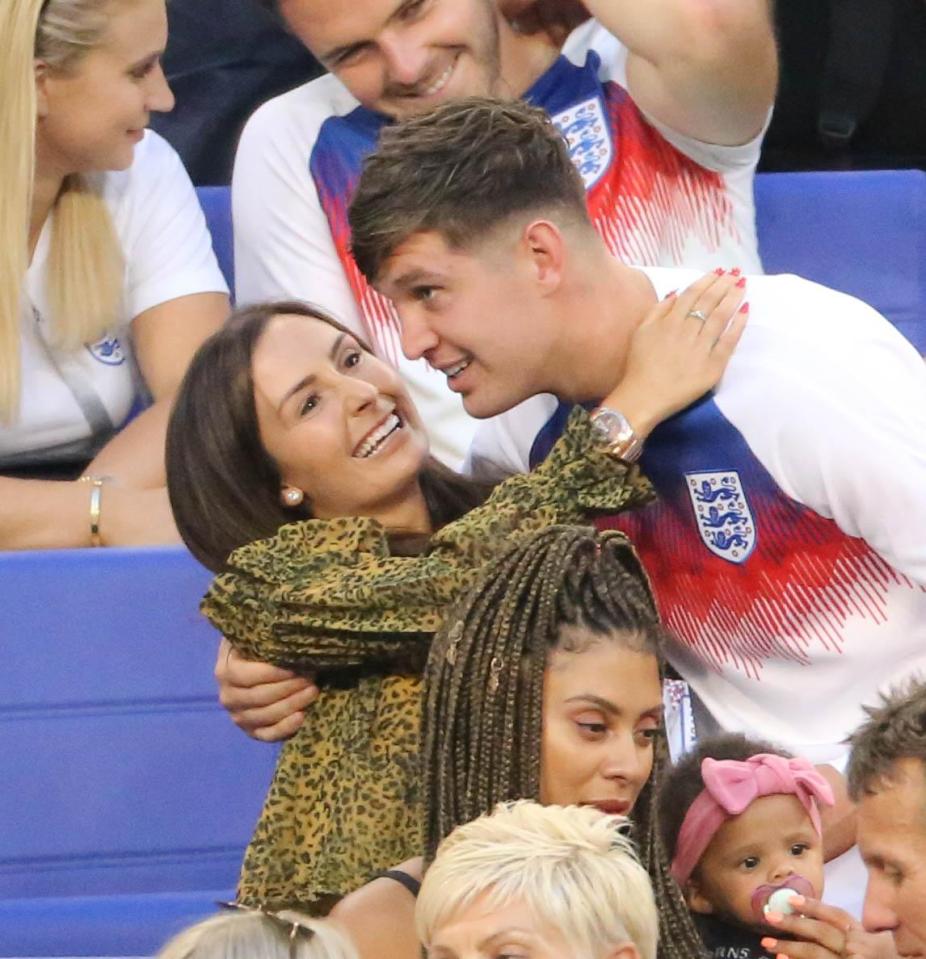  John Stones was given a hug by partner Millie Savage