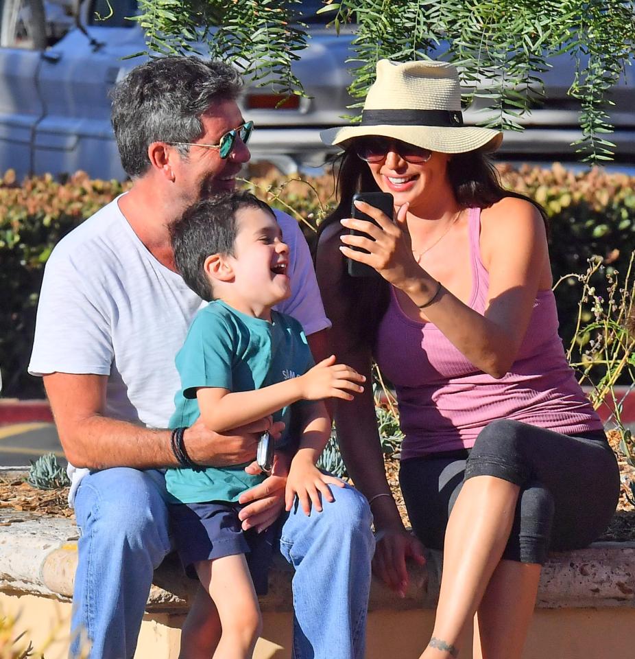  Simon Cowell shares a laugh with son Eric and girlfriend Lauren Silverman in Malibu