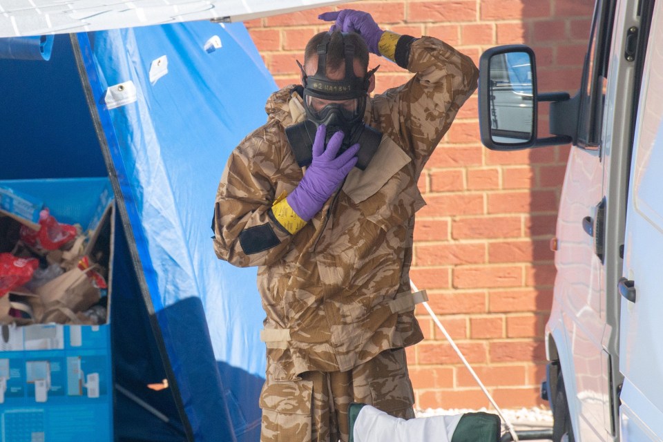 People in protective clothing at the home of Charlie Rowley, 45 after he and Dawn were exposed to Novichok