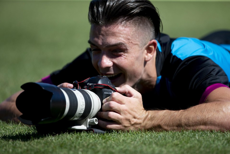 Grealish has a laugh with a photographer's camera during pre-season training