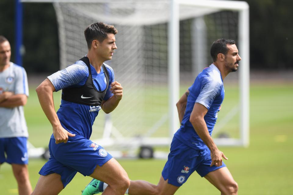  Morata and Davide Zappacosta warm up at the start of the session