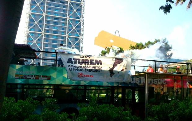 Anti-tourist activists stormed a bus in Barcelona today to protest overcrowding in holiday hotspots