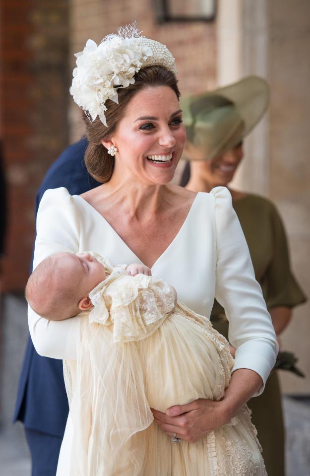  Kate was all smiles as she held baby Louis