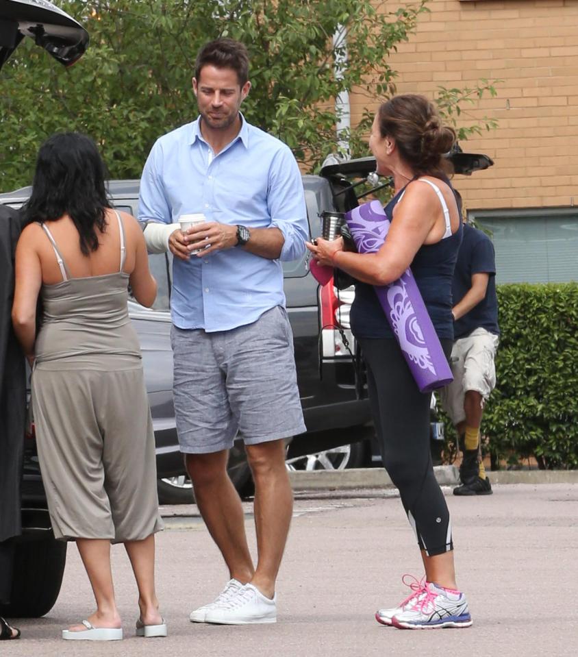  The former sports star was holding a coffee as he relaxed in the car park