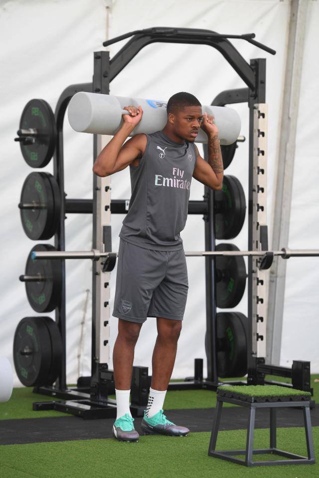  Chuba Akpom warms up during a training session at London Colney.