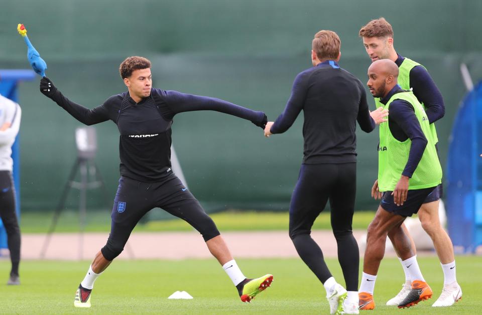  Dele Alli gets ready to strike with he chicken the weapon in training