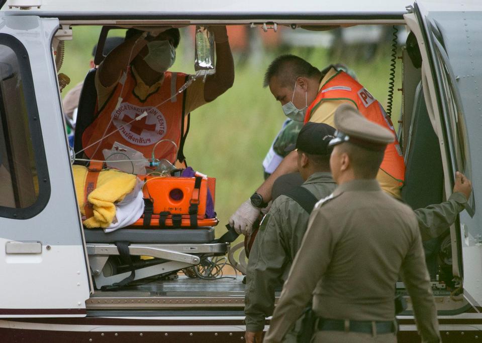  One of the last boys rescued from the Thai cave is loaded onto a helicopter before being whisked to hospital