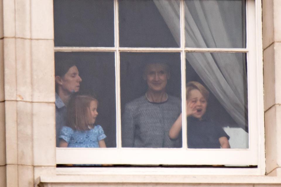  Princess Charlotte was seen giggling as her big brother George waved through the window