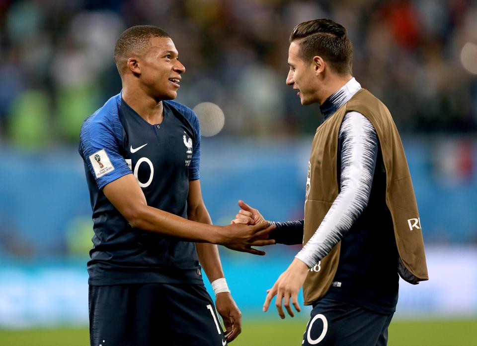  Florian Thauvin and Kylian Mbappe celebrate after France's win over Belgium