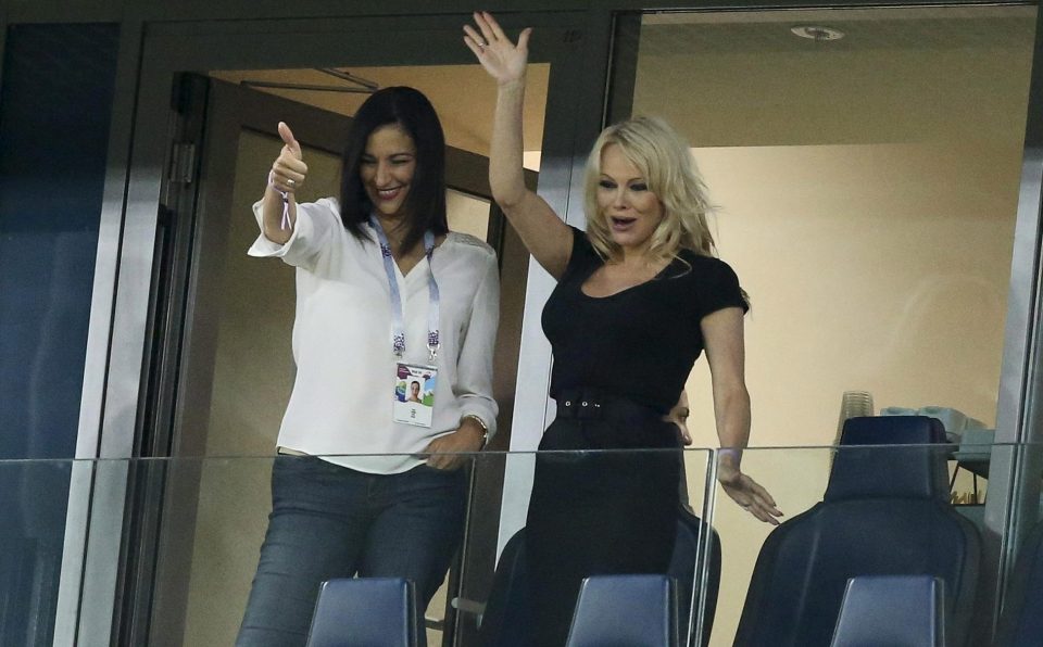  Pamela Anderson, girlfriend of Adil Rami of France, celebrates the victory with a friend