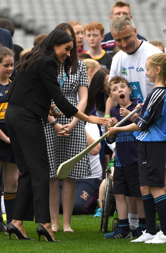  Meghan seemed eager to have a go at hurling as she met youngsters