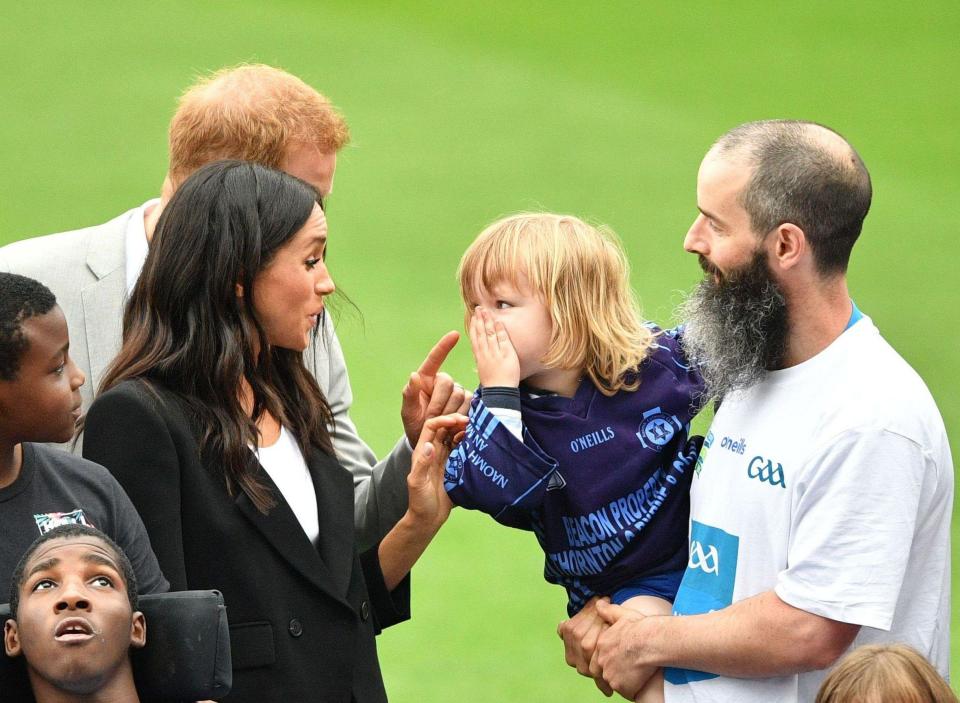  Little Walter looked chastised as Harry and Meghan jokingly told him off for stroking her hair