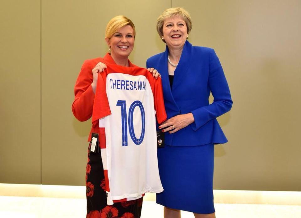  Prime Minister Theresa May poses with a Croatia shirt alongside her fellow premier Kolinda Grabar-Kitarovic