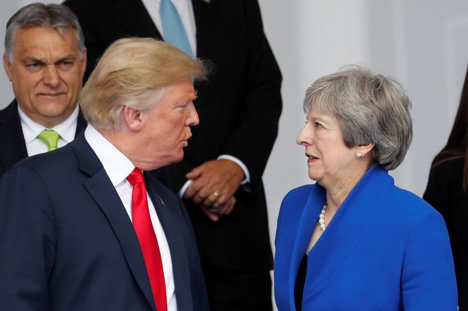  Trump and May speak during the Nato summit which is fraught with tension