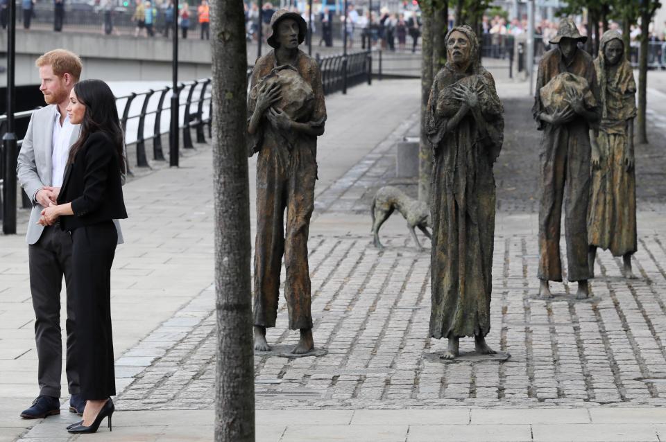  Prince Harry and Meghan, Duchess of Sussex arrive at the famine memorial on the bank of the River Liffey