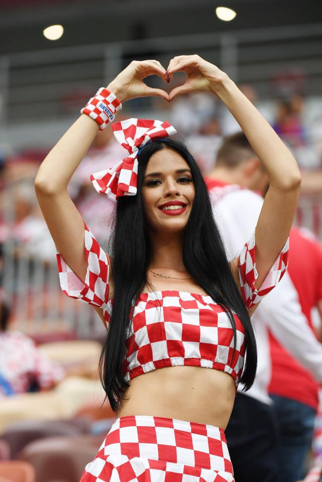  The stunning Croatia fan makes a heart gesture in the stands as the stadium begins to fill up