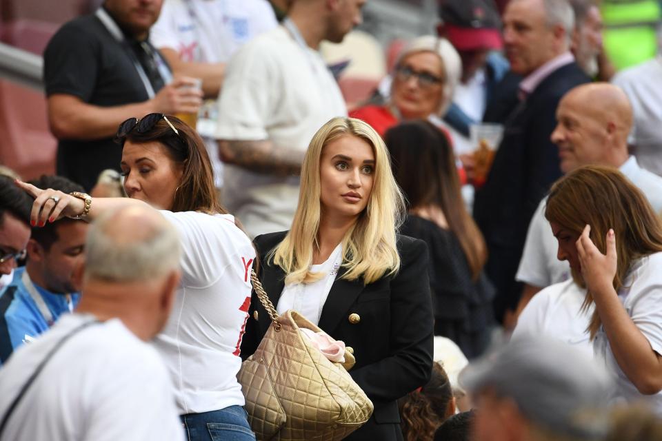  Jack Butland's partner Annabel Peyton looks for her seat near the other wives and girlfriends