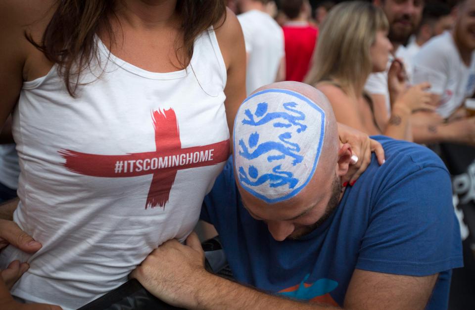  This fan has a Three Lions badge painted on to his bald head