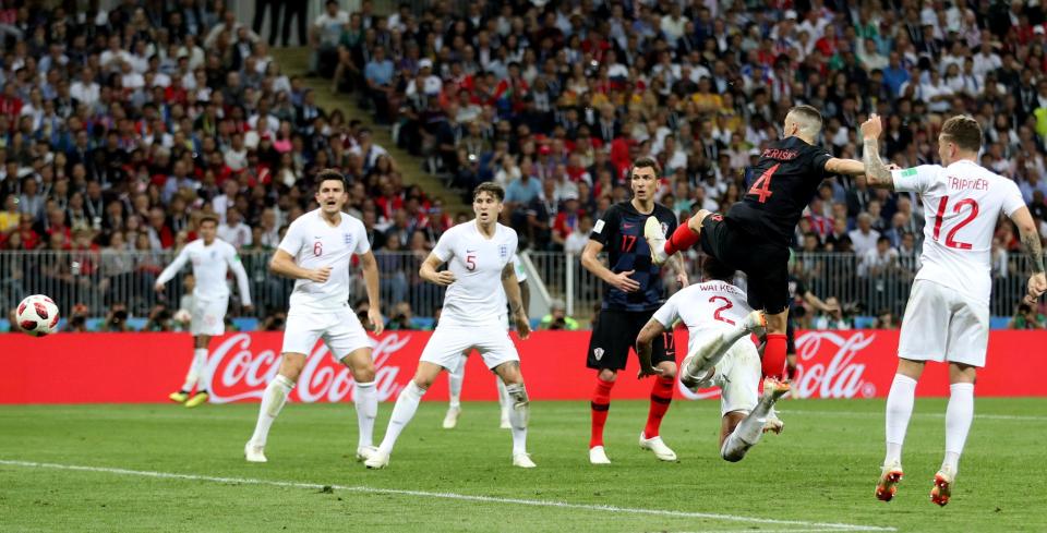  Ivan Perisic volleys the equaliser for Croatia as he swings a leg in front of Kyle Walker's head