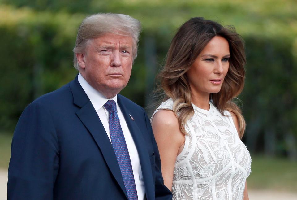  Trump walks with Melania to meet world leaders at the Nato summit yesterday