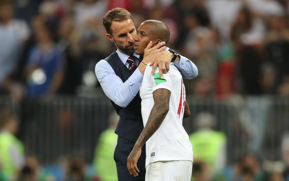  England boss Gareth Southgate consoles Ashley Young at full-time