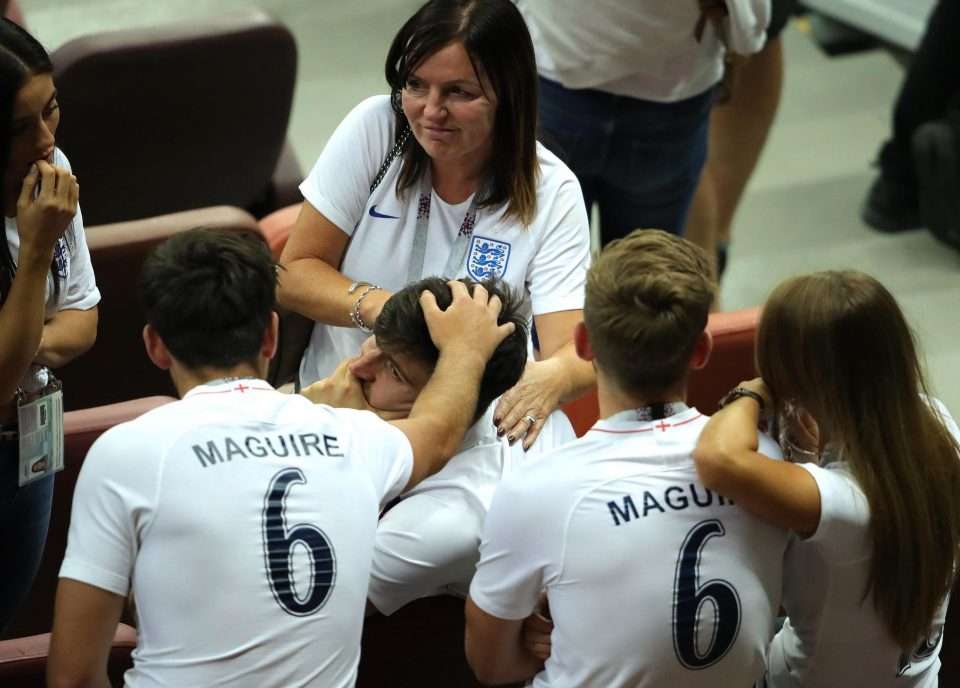  Harry Maguire being consoled by his family