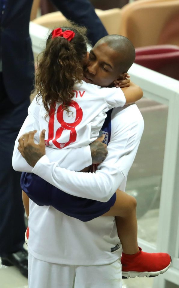  Ashley Young hugs his daughter after the final whistle