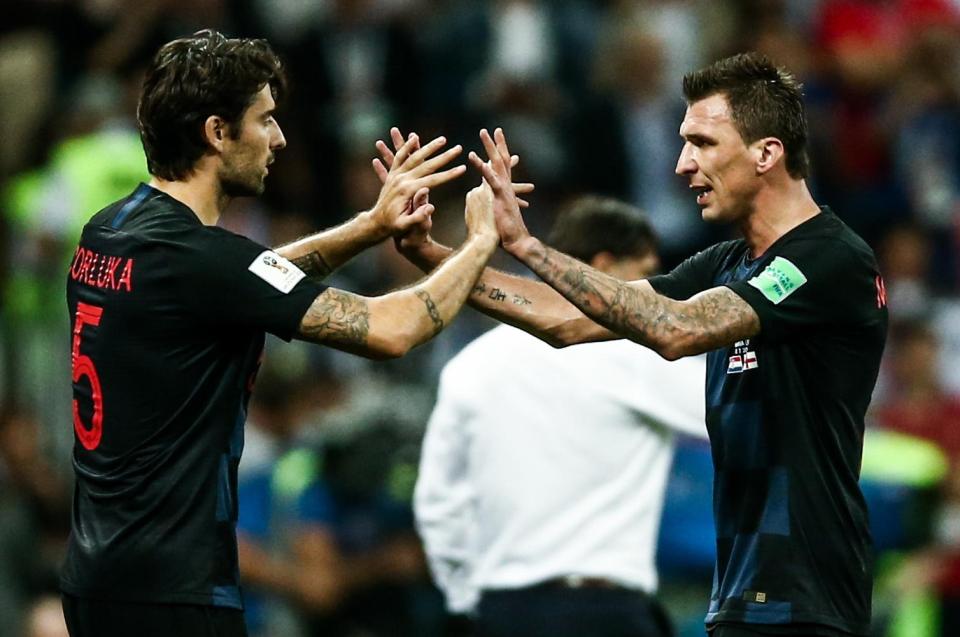  Vedran Corluka celebrates with Mario Mandzukic after Croatia beat England