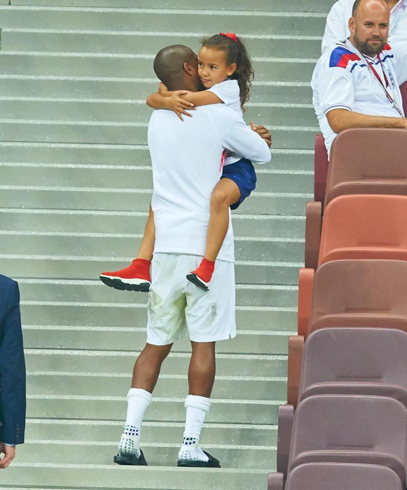  The left-back embraced his daughter after the loss