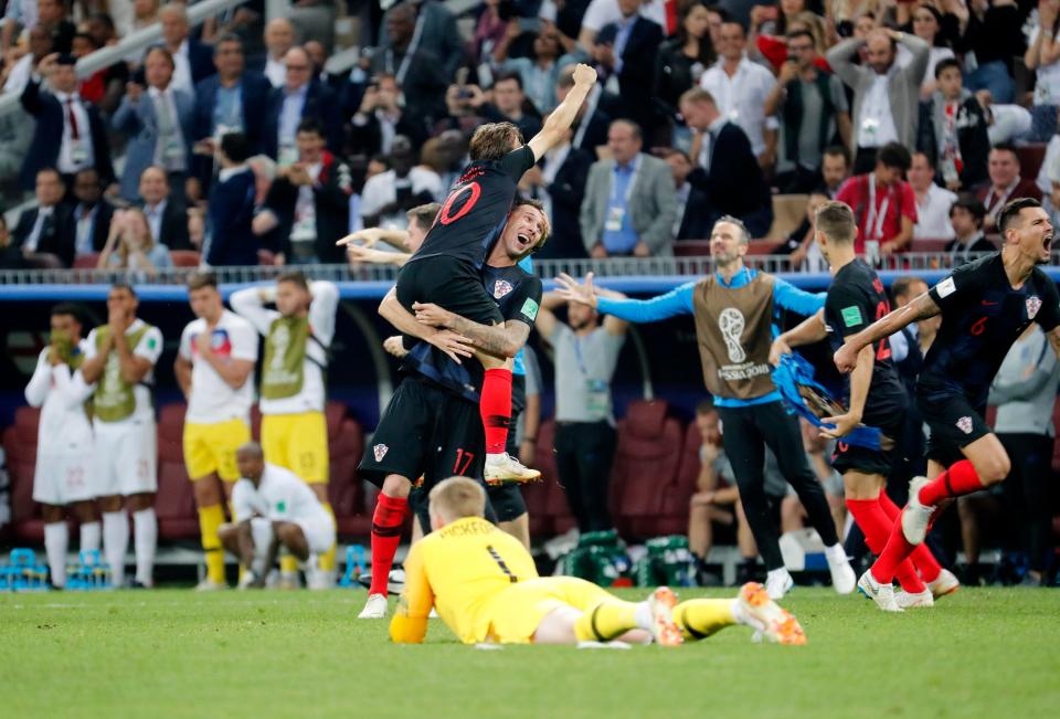  Modric and the Croatia squad react at full-time