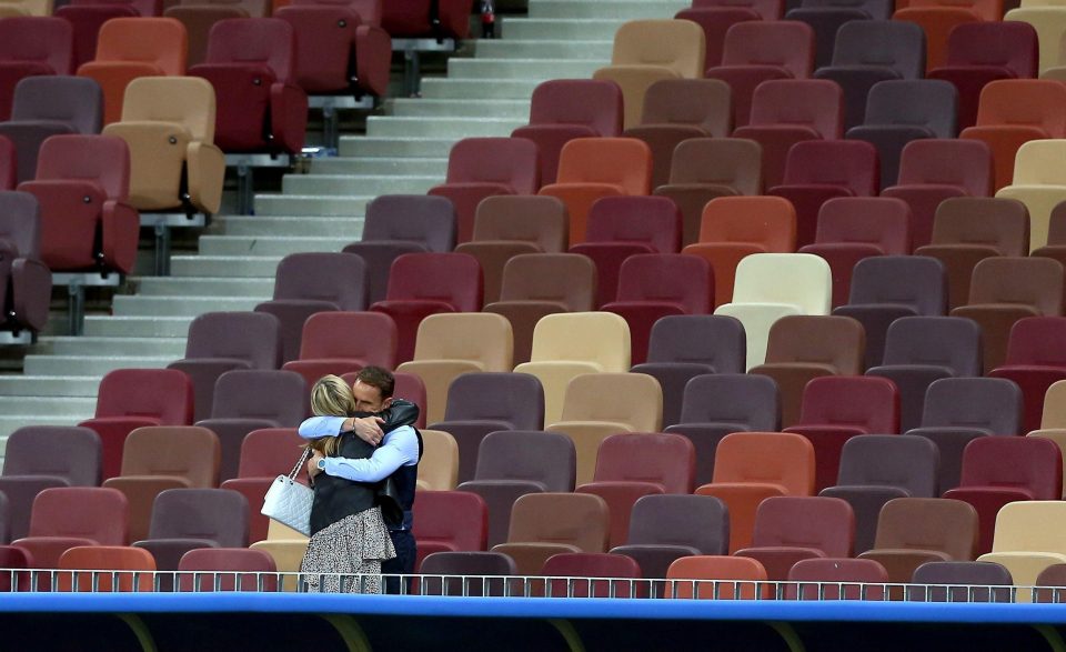  Solace in the stands . . . Southgate and wife Alison hug in empty stadium