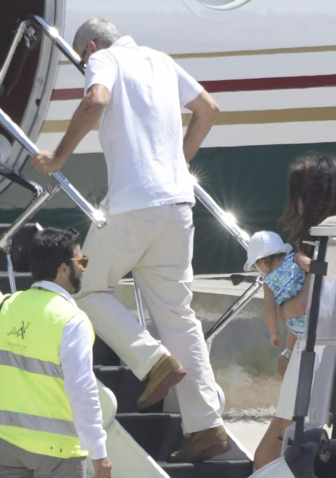  George Clooney has been pictured for the first time since his bike crash in Sardinia. It was clear he struggled to board the plane