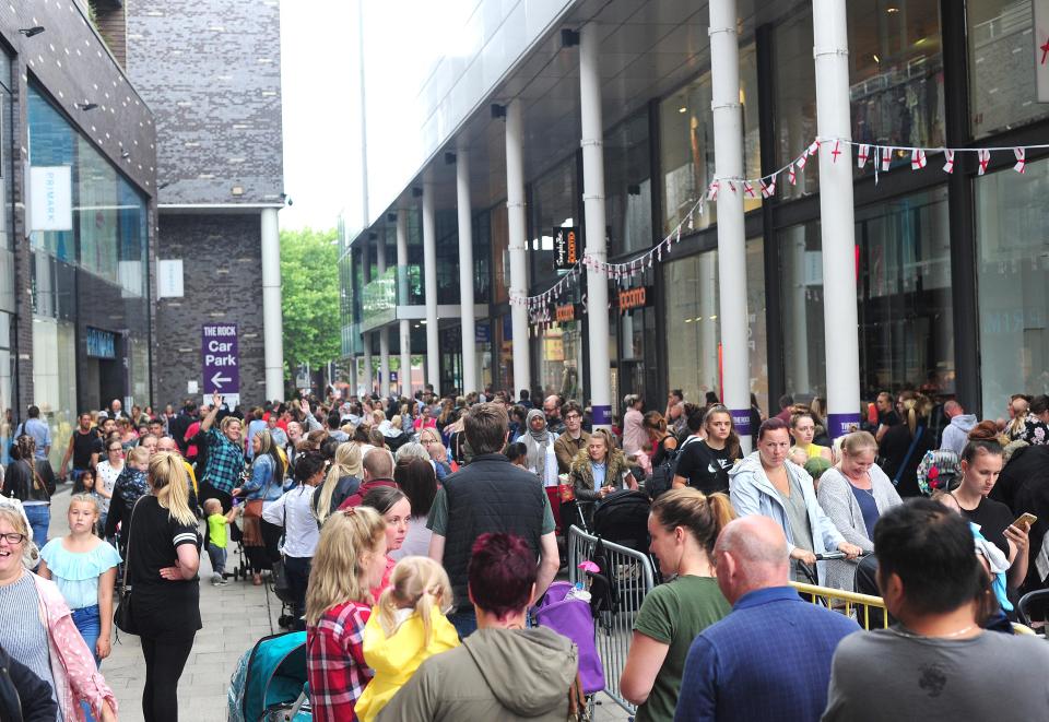  Hundreds of people queuing up for the event in The Rock, Bury