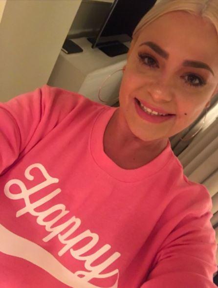 Ant McPartlin’s estranged wife Lisa Armstrong  looked happy again following the couple’s split as she posed in a friend’s statement jumper yesterday