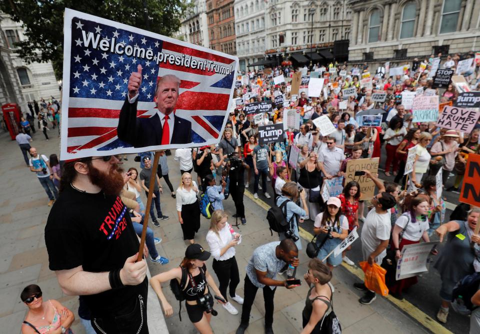  A Trump supporter waves a banner in support of the US President