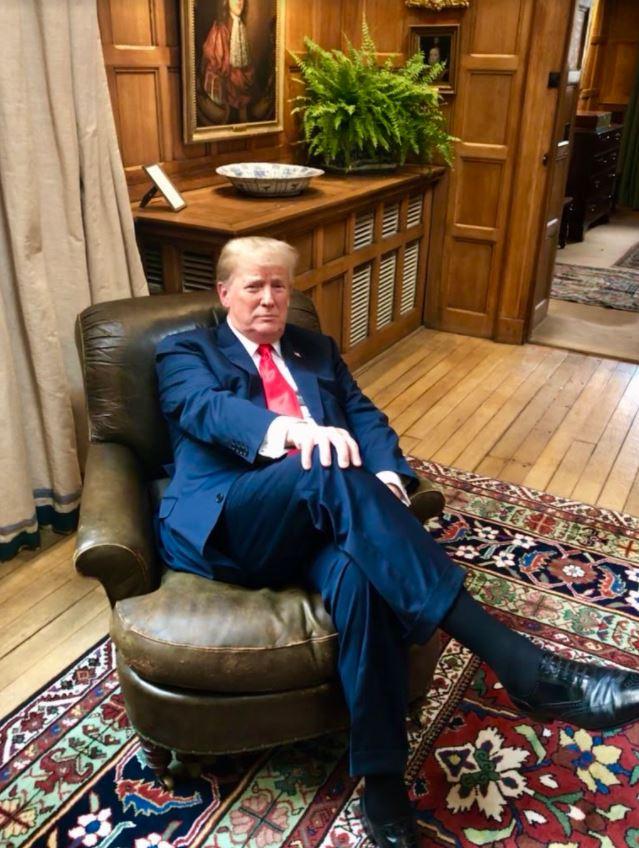  President Trump sits in Churchill's chair during his visit to see Theresa May at Chequers on Friday