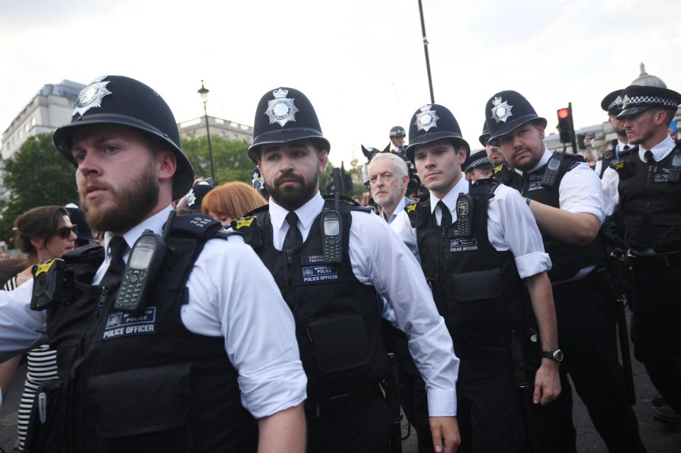  Jeremy Corbyn is given a police escort through Trafalgar Square this afternoon