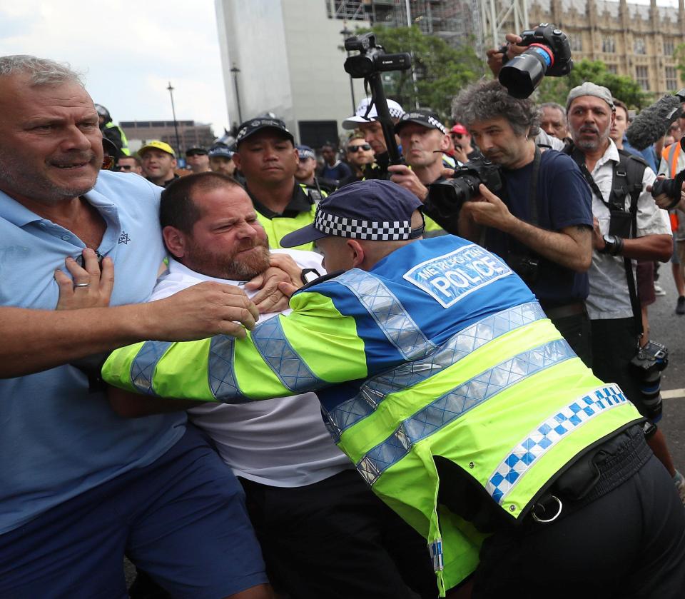  Members of the Met Police were seen having to hold some of the demonstrators back