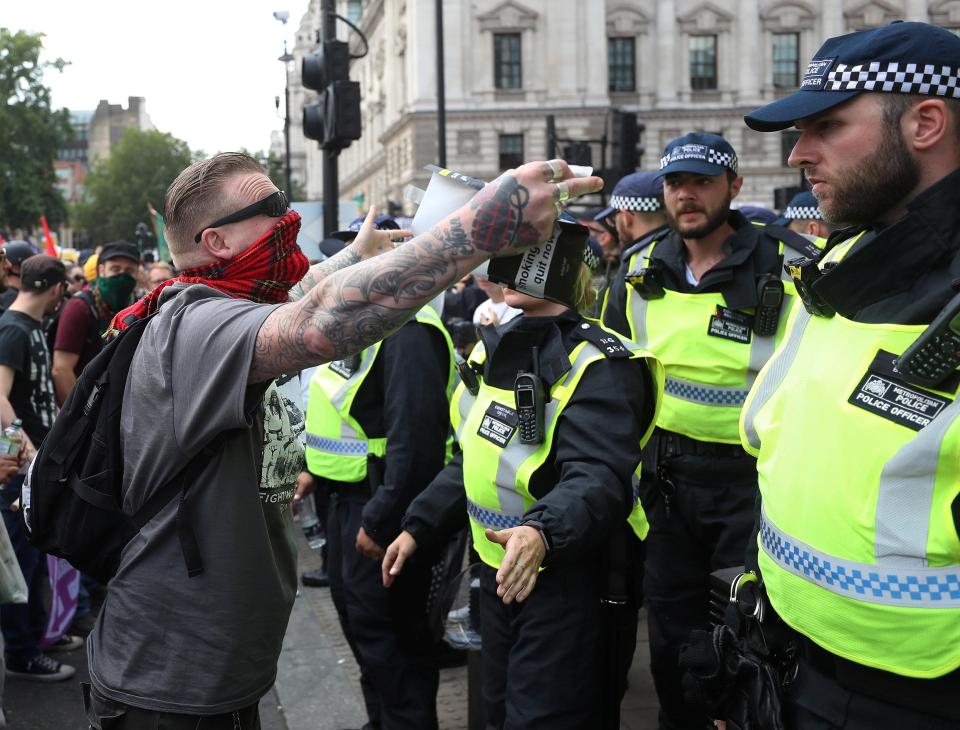  Activists covering up their faces expressed their frustrations with police