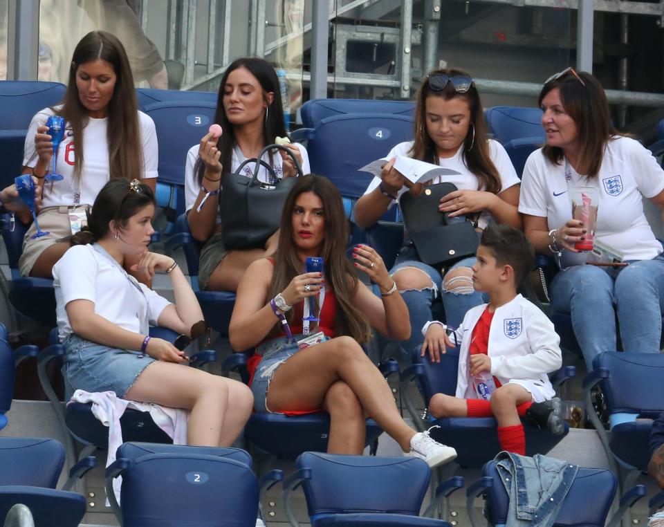  Jamie Vardy's wife, Rebekah, looked uninterested during England's defeat while Fern enjoyed a little snack and others in the gang had a drink