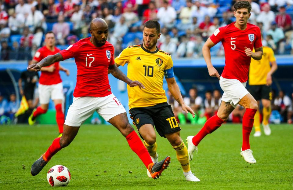  Fabian Delph, Eden Hazard, and John Stones in action.