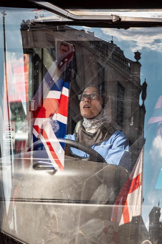  A bus driver looks on as the vehicle is blocked by protesters at Trafalgar Square earlier today