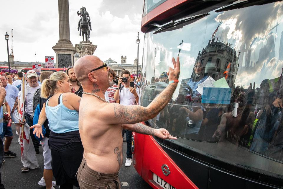  Supporters of EDL founder Tommy Robinson block a bus at Trafalgar Square